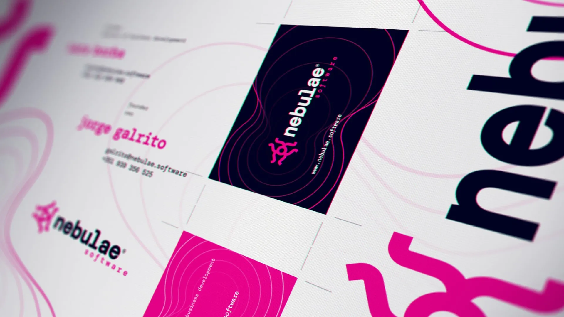Close-up of a digital design with vibrant pink and dark graphics for Nebulae Software branding.