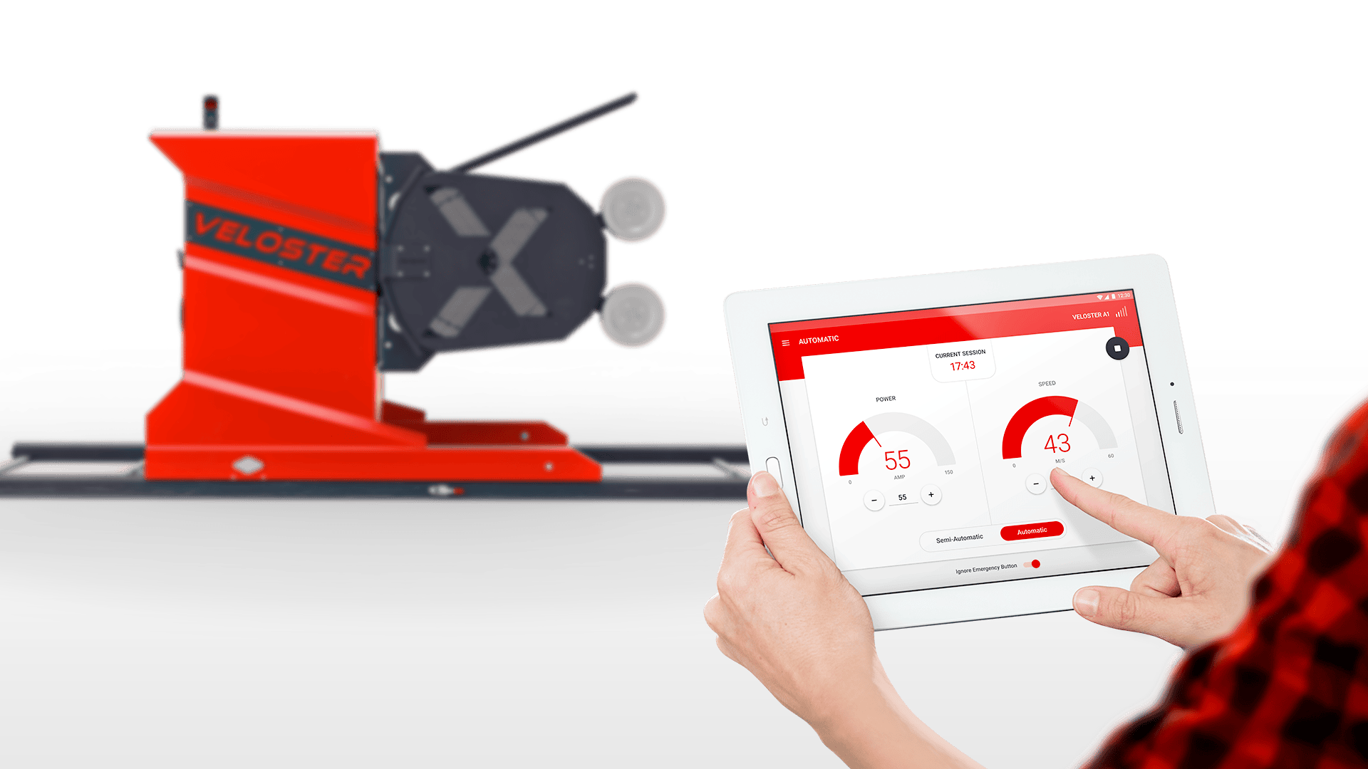 Mobile app showing power and speed metrics next to a red Veloster machine in a tech setting.